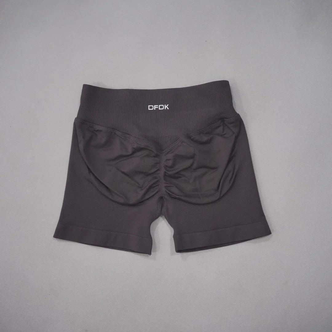 Black high-waisted gym shorts with a seamless design and scrunch-butt detail for a flattering fit.
