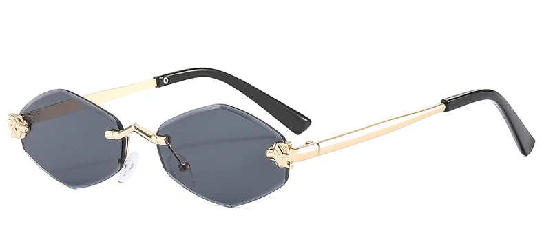Rimless sunglasses with multi-angled rhombus lenses, gold metal temples, and black ear tips. Stylish and geometric design.