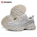 Chunky white sneakers with a breathable mesh upper, layered with silver accents and a thick rubber sole.