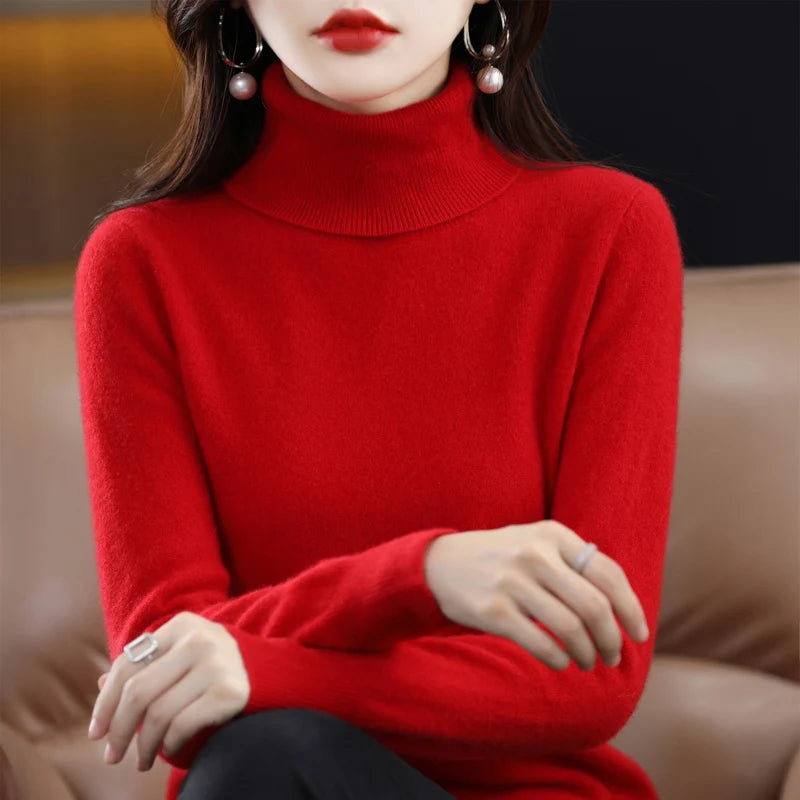 Red turtleneck sweater with a relaxed fit and ribbed cuffs, showcasing a soft cashmere and merino wool blend.