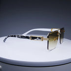 Rimless classic square sunglasses with gradient lenses and gold-tone metallic accents, featuring a black and white printed temple.