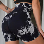 High-waisted gym shorts in black and white tie-dye pattern, featuring a scrunch detail for lifting and contouring.