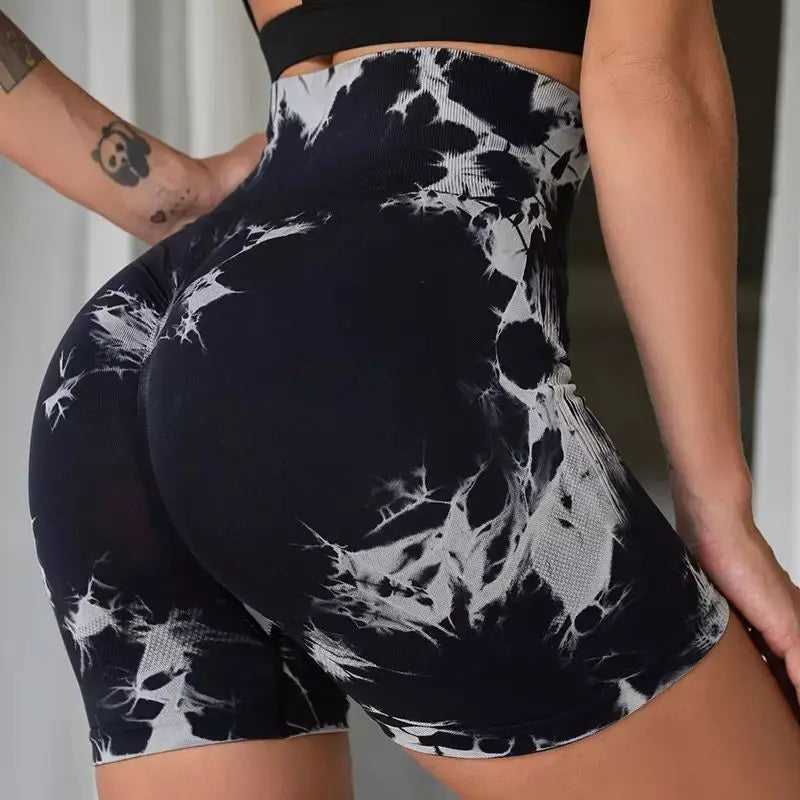 High-waisted gym shorts in black and white tie-dye pattern, featuring a scrunch detail for lifting and contouring.