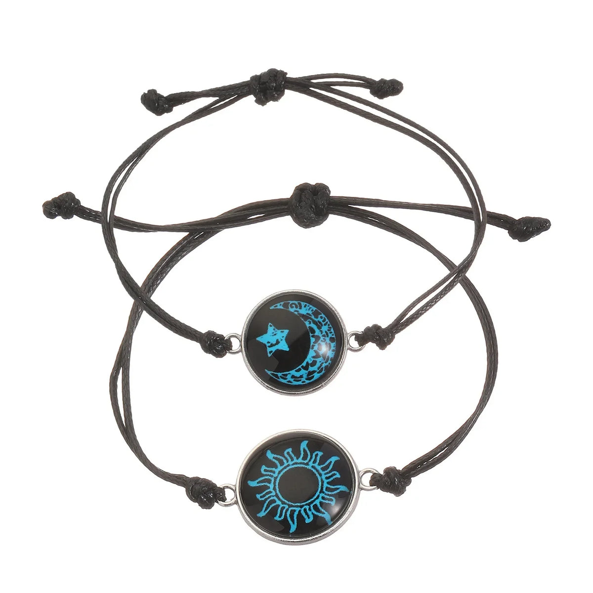 Luminous black nylon bracelet set featuring blue sun and moon designs, adjustable with sliding knot closures.