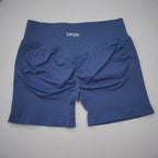 High-waisted navy gym shorts with a scrunch butt design, seamless knit fabric, and wide waistband for tummy control.