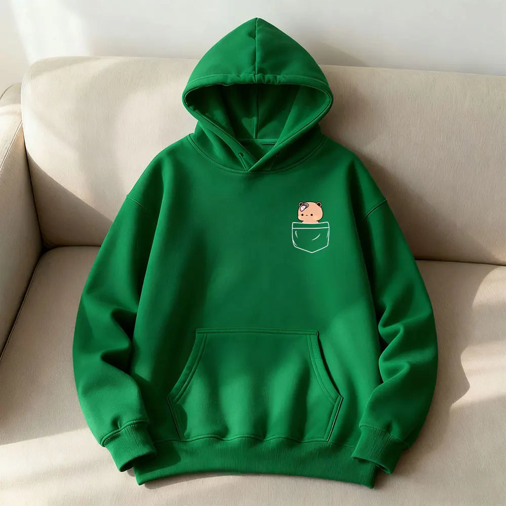 Green oversized hoodie featuring an embroidered bear in a pocket design, with a kangaroo front pocket and adjustable hood.