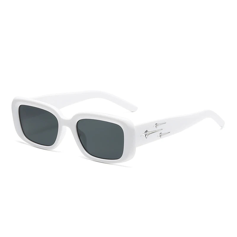 White wrap-around sunglasses with dark tinted lenses and metallic star embellishments on the temples.