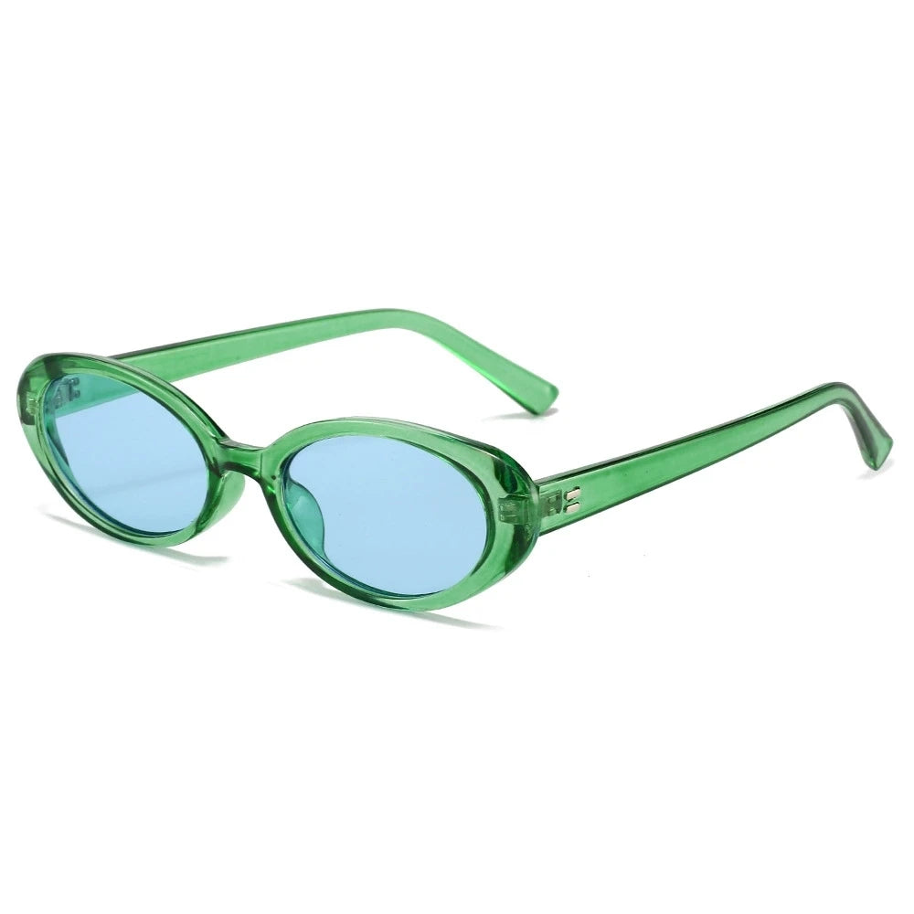 Vintage oval minimalist sunglasses with a transparent green frame and blue lenses. Sleek, lightweight design with a subtle shine.