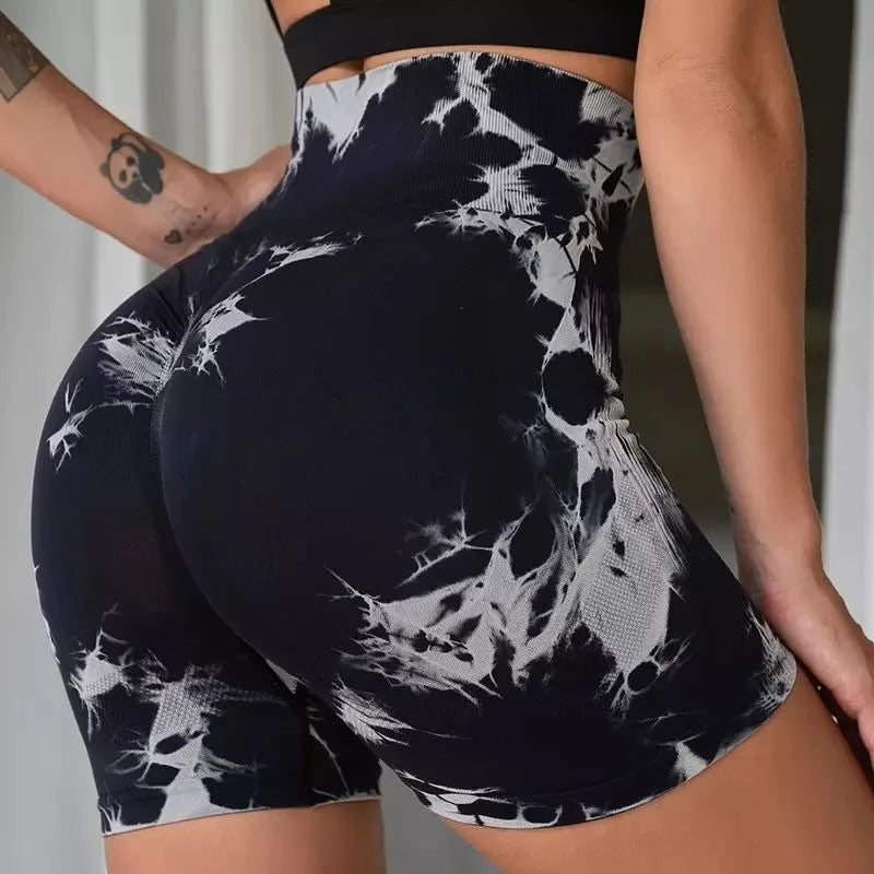 High-waisted gym shorts featuring a black and white tie-dye pattern, designed for a secure fit and comfort.