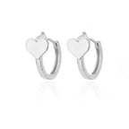Chunky huggie earrings made from shiny stainless steel, featuring simple heart drop designs in a minimalist style.