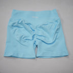 Light blue seamless gym shorts featuring a high-waisted design and integrated scrunch-butt detail.