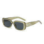 Olive green cyberpunk sunglasses with dark tinted lenses, featuring an aerodynamic wrap-around frame and metallic detailing.
