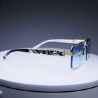 Rimless classic square sunglasses with blue gradient lenses and black and white marbled temples, accented with gold-tone hinges.