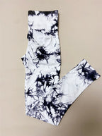 High-waisted leggings in a black and white abstract tie-dye pattern, featuring a seamless design and wide waistband.