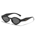 Bold black cat-eye sunglasses with a thick frame and tinted lenses, showcasing a vintage geometric design.
