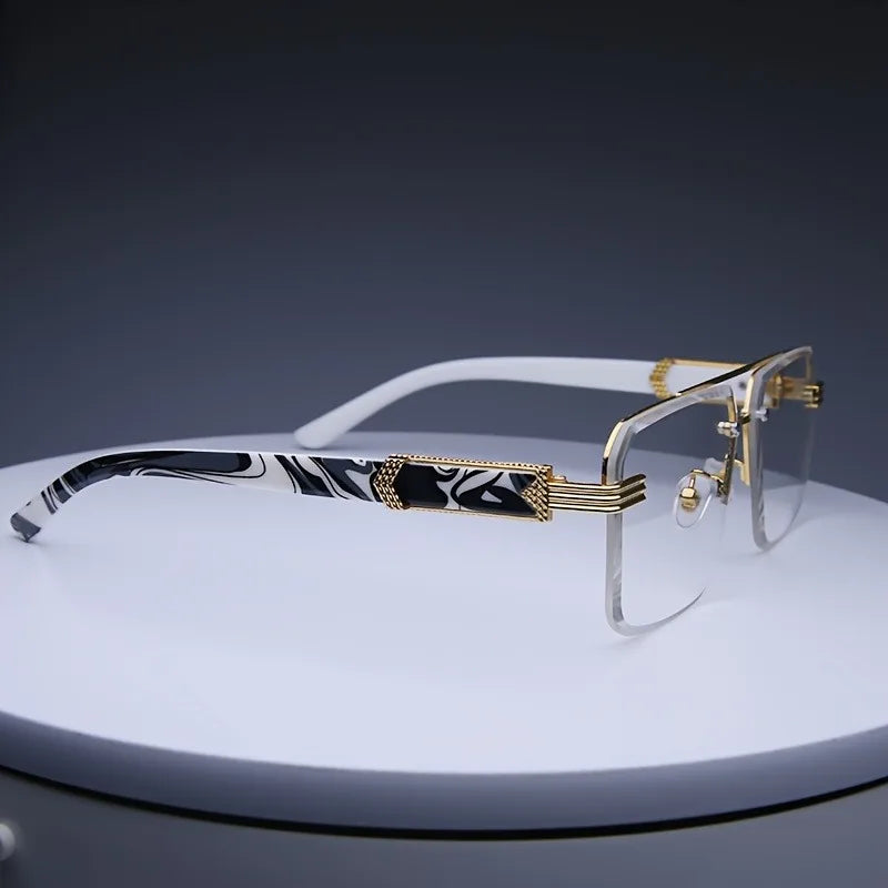 Square rimless sunglasses with a clear lens, gold-tone metallic accents, and a black-and-white marbled pattern on the temples.